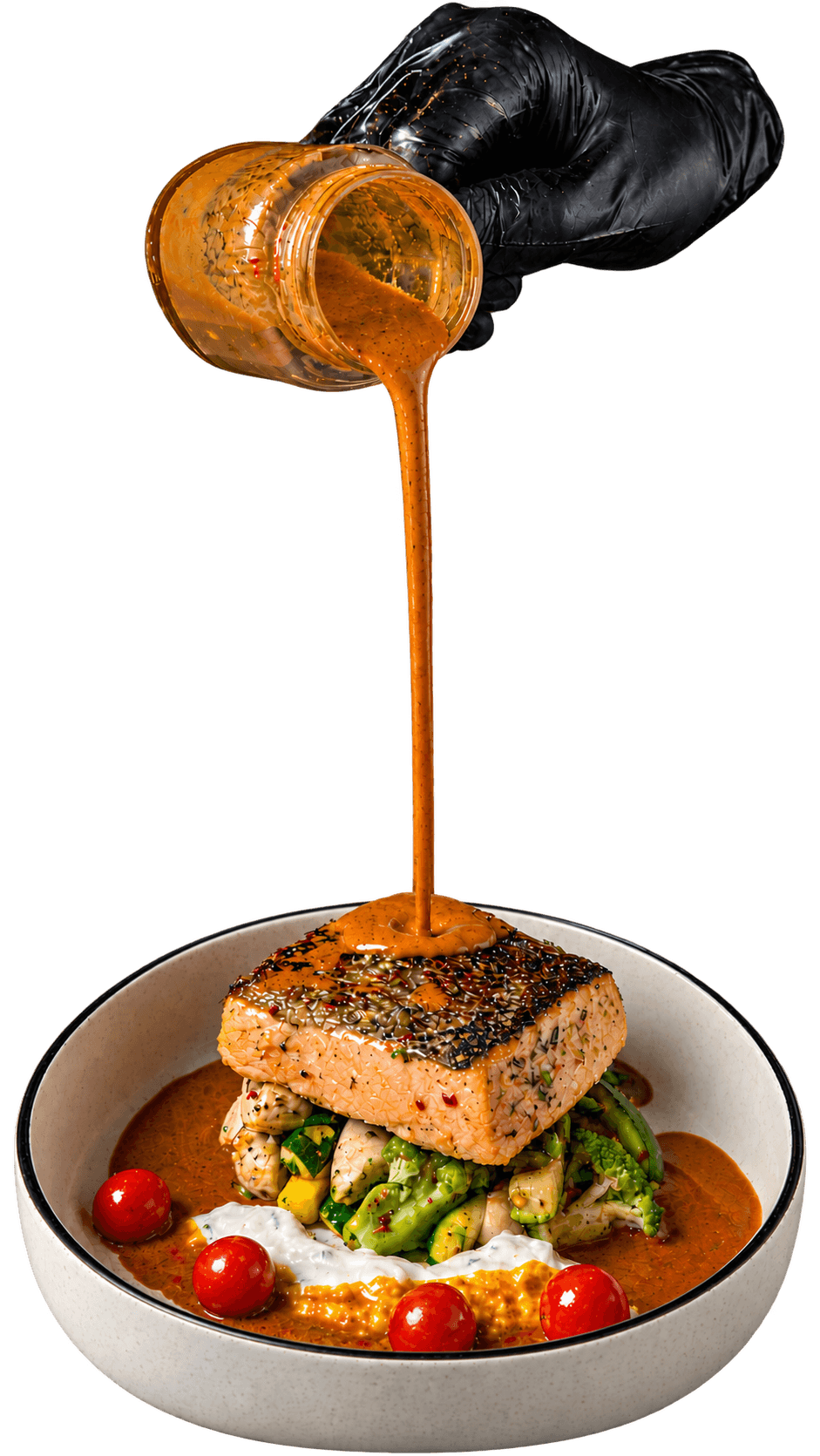Unc Swift™ sauce being poured over a plated salmon dish